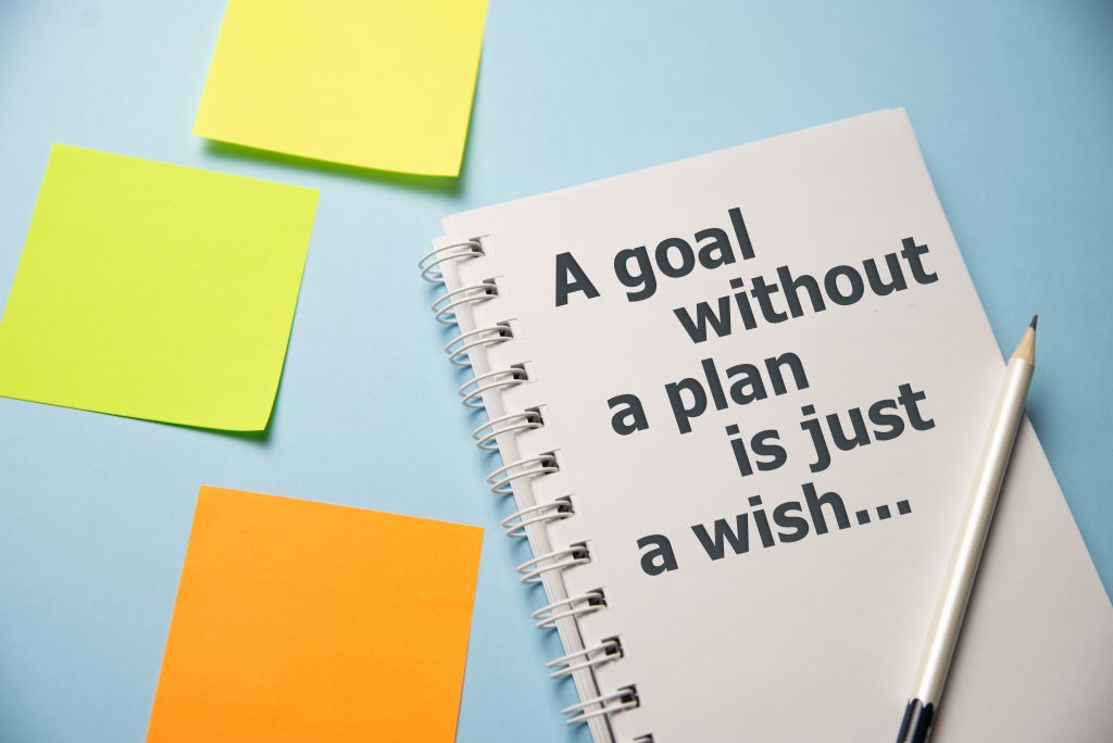 notebook with the quote a goal without a plan is just a wish